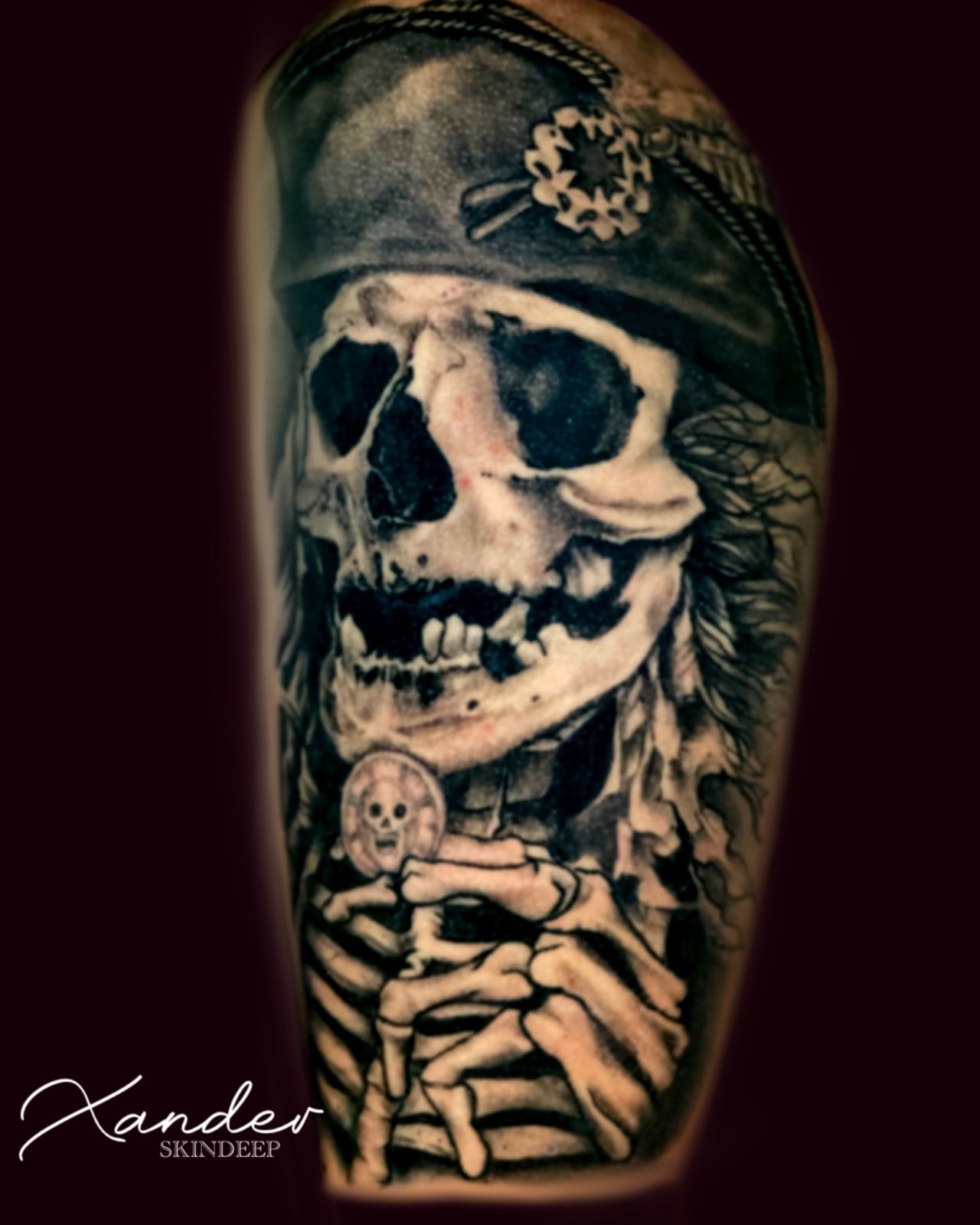 Detailed black and grey skull tattoo